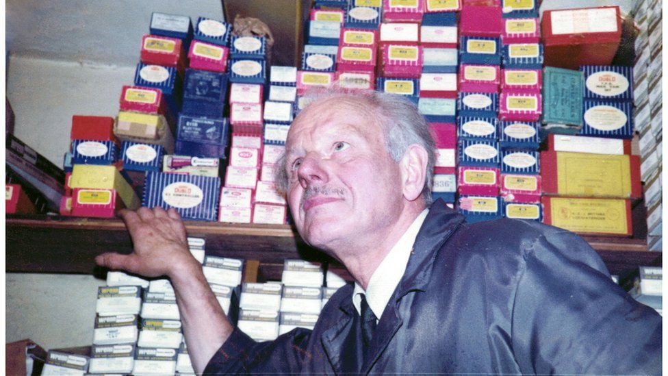 Norman Keith inspects model trains at Hatton's in about 1980